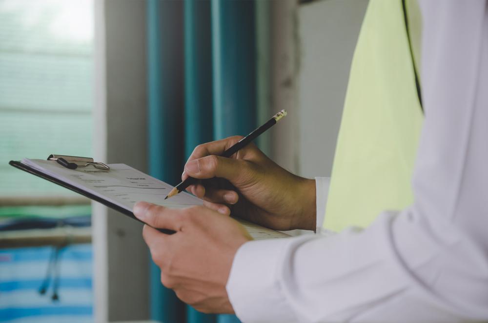 Architect reviewing construction documents for a commercial project