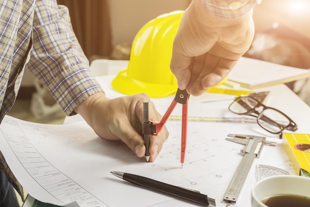 Experienced Sacramento architect discussing plans for a commercial project